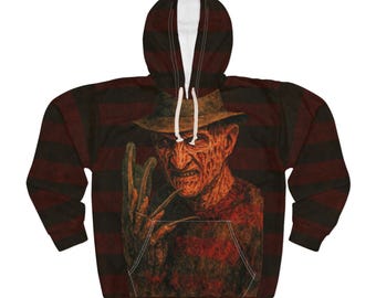 Könnte beinhalten: Ein Kapuzenpullover mit einer Grafik einer Horrorfilmfigur. Das Design zeigt ein Porträt der Figur mit Hut und Klingenhandschuh. Der Hintergrund hat rot-schwarze Streifen. Die Kapuze ist mit weißem Stoff gefüttert.