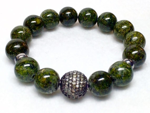 12mm Russian Jade with one 14mm Rhodium plated Micro Pave’ CZ bead bracelet