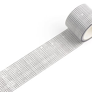 May include: A roll of white washi tape with a black grid pattern. The tape is partially unrolled, showing the design.