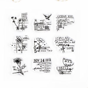May include: A sheet of clear stamps with black ink designs. The stamps feature various floral designs, a bird, a number, a date, and text. The text includes "1881", "Chap. XIII", "Love", "Nov 14 1911", "Pretante 23 9.01", "E38211", and "2 chance".