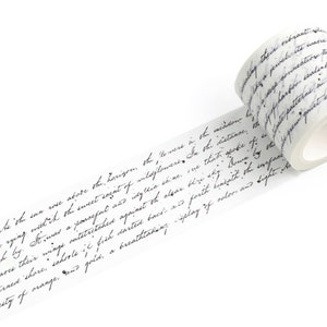 May include: A roll of white washi tape with black handwritten text. The text is a quote about the beauty of nature and the sea.