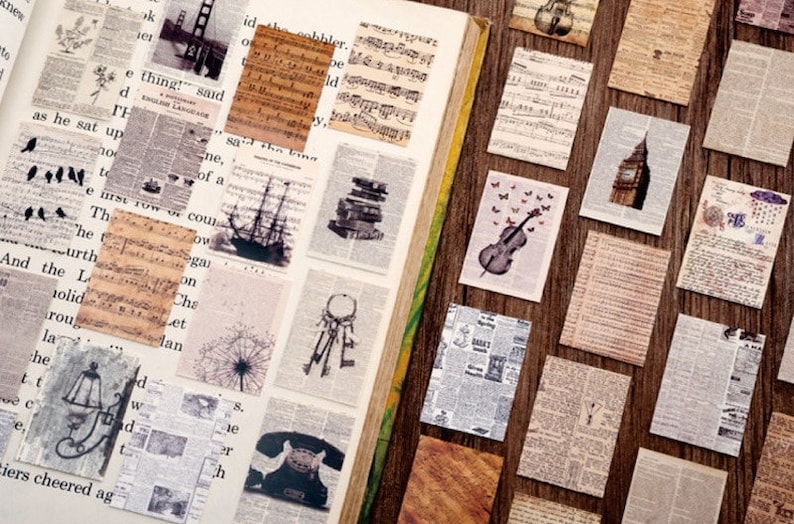 May include: A collection of vintage-style paper ephemera with various designs, including musical notes, a ship, a dreamcatcher, a telephone, a dandelion, a cityscape, and a violin. The papers are printed on a cream-colored background with black ink.