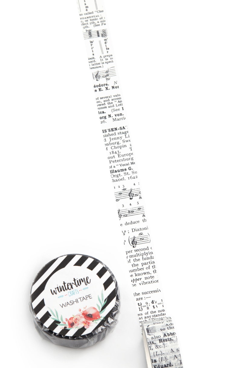 Washi tape with details from a vintage music dictionary. White background.