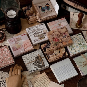 May include: Assortment of decorative paper ephemera with various designs and patterns. Includes floral, geometric, and text-based designs. Some papers have a vintage aesthetic.