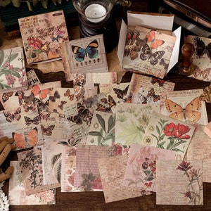 May include: A collection of vintage-style scrapbook paper featuring butterflies, floral designs, and other nature-inspired motifs. The paper is printed on a textured background and has a distressed look.