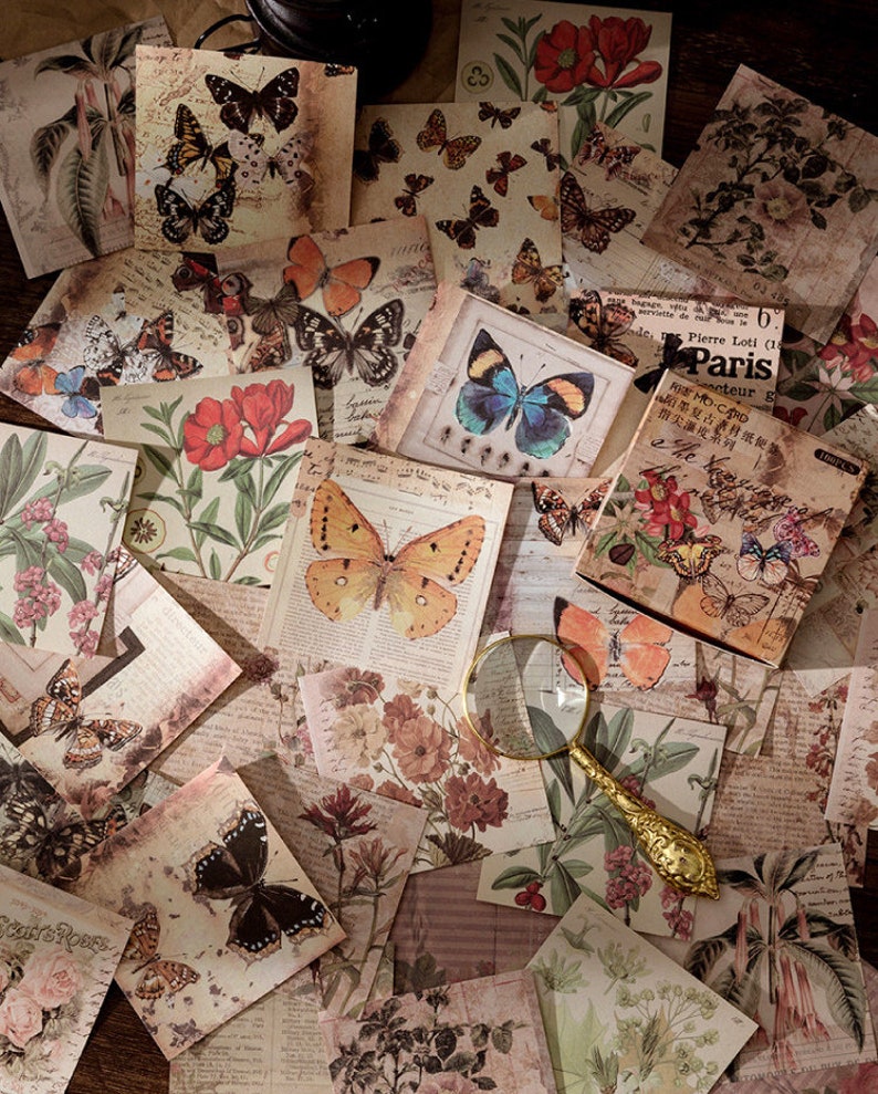 May include: A collection of vintage-style decorative paper squares featuring butterflies, flowers, and botanical illustrations. The papers have a distressed, aged look and are perfect for scrapbooking, card making, or other craft projects.