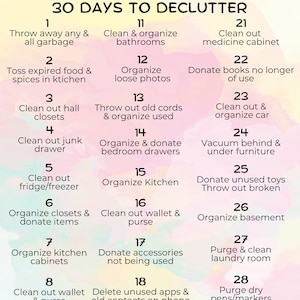 May include: A colorful chart with a pink and white background lists 30 decluttering tasks for each day of the month. The chart is divided into three columns, each with 10 tasks. The tasks are numbered 1 through 30.