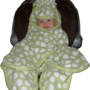 Lotsa Dots Green is our unique Cuddlebabe® Wearable Blanket.  It was created based on parent & baby travel needs, and won a coveted award!