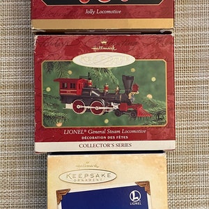 Three (3) Hallmark Keepsake Die-Cast Ornaments: Lionel &quot;The General&quot; & Hiawatha Locomotive and Jolly Locomotive with Boxes