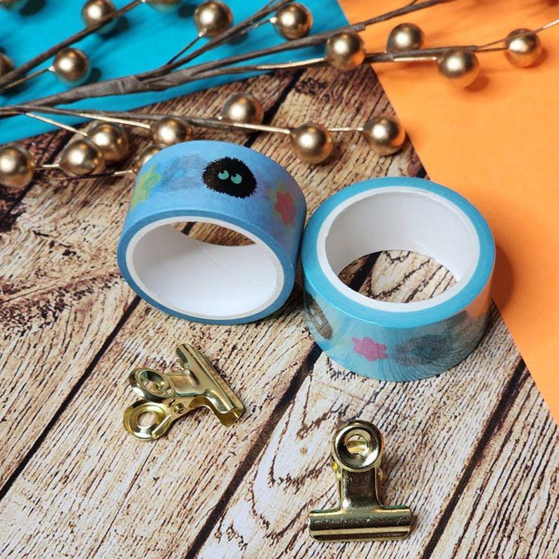 Soot sprite washi tape inspired by Studio Ghibli, konpeito candy on blue backing.