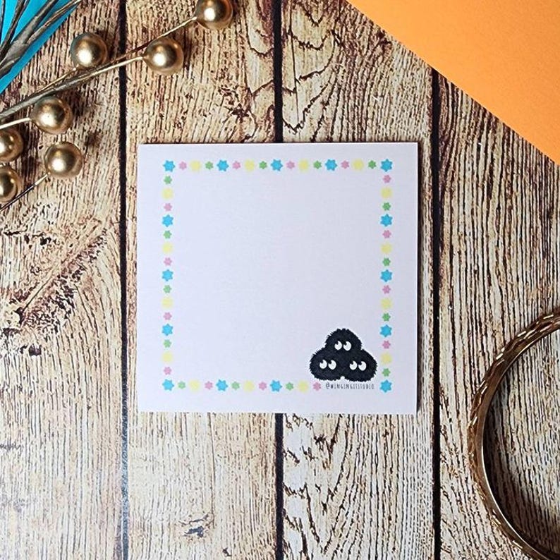 Pink sticky note with soot sprite with konpeito candy border inspired by Studio Ghibli.