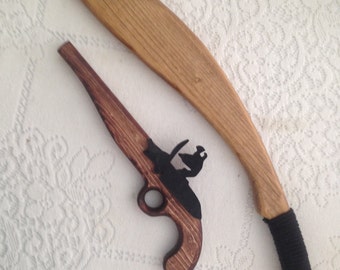 A pirate's life for me ... a combo of pretend weapons consisting of a flintlock pistol and machete for that pirate in your life!