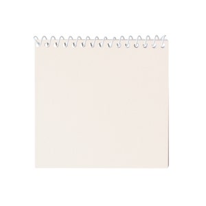 May include: A square, cream-colored notepad with a silver spiral binding at the top. The notepad is blank, with a smooth, unlined surface. The paper appears to be thick and of high quality, suitable for writing or sketching.