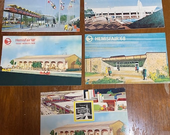 May include: Five vintage postcards featuring images of the 1968 HemisFair '68 World's Fair in San Antonio, Texas. The postcards feature various buildings and attractions from the fair, including the iconic Tower of the Americas.