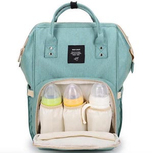 May include: A light green diaper bag backpack with a black label that says "BOFIDER" and three clear baby bottles inside.