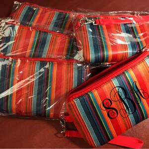 Small Wristlet handbag in a serape print with removable hand strap