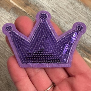 May include: Purple sequined crown patch with a velvet backing.