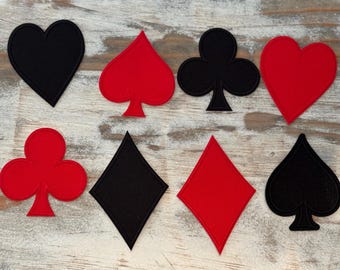 May include: Eight felt patches in the shapes of playing card suits: black heart, red spade, black club, red heart, black diamond, red diamond, black spade, and red club.