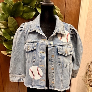 May include: A set of three ceramic mugs with a speckled, matte finish. The mugs are in shades of cream, light gray, and dark gray. Each mug has a simple, minimalist design and a rounded handle. Perfect for coffee or tea.