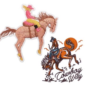 May include: Two embroidered iron-on patches featuring a woman riding a bucking horse. The first patch is pink, yellow, and brown. The second patch is brown, orange, and blue with the text "Cowboy Way".
