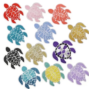 May include: A collection of embroidered turtle patches in various colors, including red, pink, orange, teal, light blue, gold, black, purple, and yellow. Each patch features a detailed design with a textured appearance, perfect for adding to clothing or accessories.