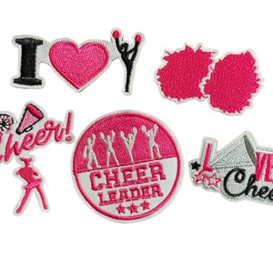 May include: Set of iron-on patches featuring cheerleading themes. Patches include "I Love Cheer", "Cheer Leader", "Cheer!" and "Love Cheer".