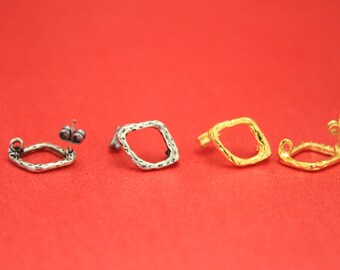 May include: Three pairs of earrings with a square shape. The earrings are made of metal and have a textured finish. The earrings are available in silver, gold, and a darker metal.