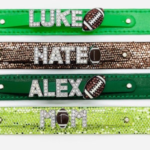 May include: Four green, brown, and lime green leather bracelets with rhinestones spelling out the names "LUKE", "NATE", "ALEX", and "MOM" with a football charm on each.