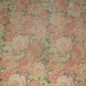 May include: A floral pattern featuring large, orange and peach-colored roses with green leaves against a dark background. The design is repeated across the fabric, creating a dense, textured look. The overall theme is a vintage floral pattern.