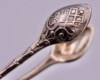 Impresionantes pinzas para azúcar bañadas en plata antigua