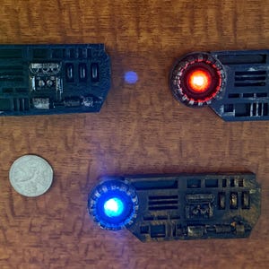 May include: A white ceramic mug with a black handle and the text "But First, Coffee" in a bold, black font. The mug is set against a neutral background, highlighting its simple design. The mug is approximately 4 inches tall.