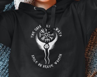 May include: Black hooded sweatshirt with a white graphic design featuring a winged symbol, a compass, and the text "The Gods Always Smile On Brave Women".