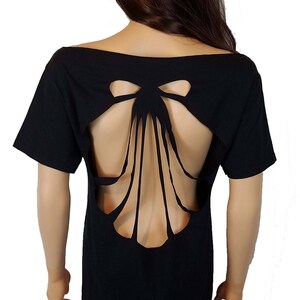 May include: Black short-sleeved t-shirt with a large cut-out bow design on the back.
