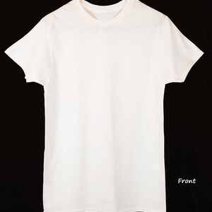 May include: A plain white t-shirt with short sleeves and a crew neck. The shirt is laying flat on a black background. Front.