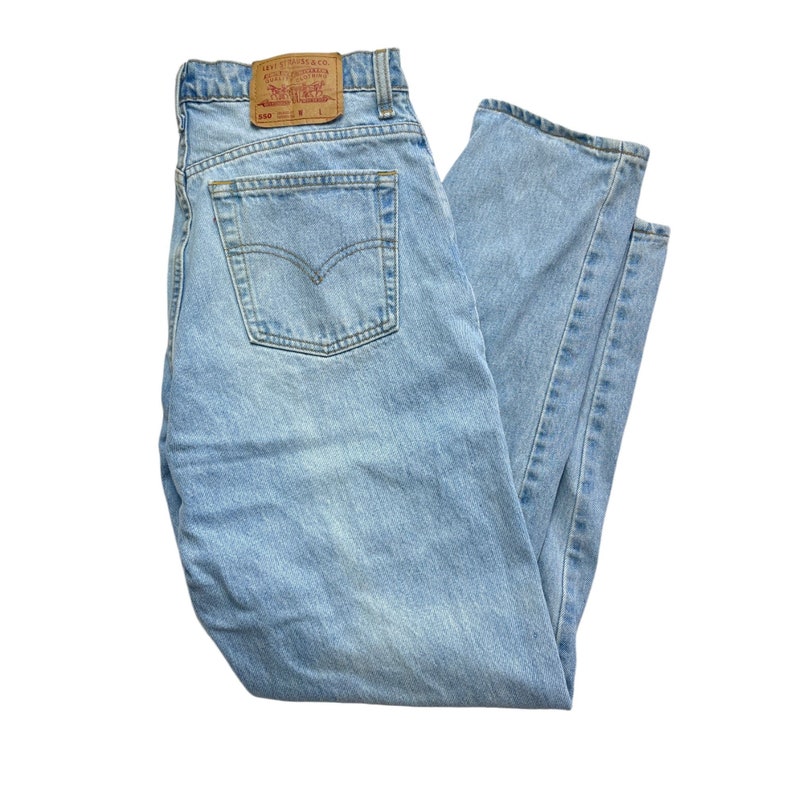 Vintage 90s Levi#39;s 550 Light wash denim jeans  32
