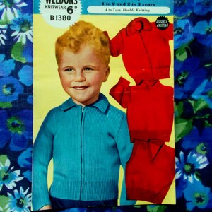 May include: A vintage knitting pattern from Weldons Knitwear, featuring a child in a teal zip-up sweater. The pattern includes instructions for a slipover, pullover, and lumber jacket. Suitable for children aged 1 to 3 years. The pattern is marked as 'Double Knitting'.