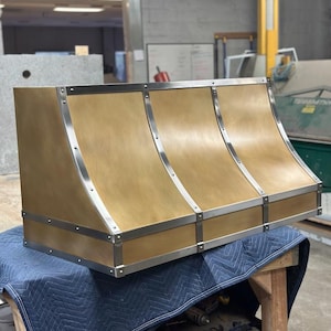 Custom Patina Brass Range Hood with Stainless Steel Straps – Luxury Kitchen Statement Piece