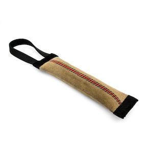 May include: A tan and black dog chew toy with a red stripe. The toy is made of a durable fabric and has a loop handle for easy gripping.