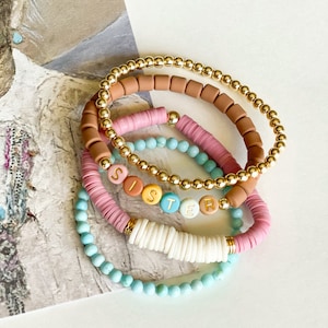 The {Sister} bracelet set. Four Stretch bracelets. Turquoise, polymer clay, coral, letter beads, gold hematite, peace. Adult or child size