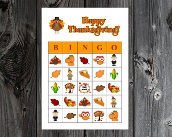May include: A Thanksgiving bingo card with images of turkeys, pumpkins, leaves, corn, pies, and pilgrims. The card says "Happy Thanksgiving!" at the top.