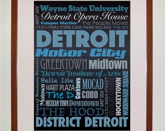 May include: A black and blue word cloud with the word "DETROIT" in large, bold, blue letters. The word cloud includes various Detroit landmarks, neighborhoods, and points of interest, such as "Motor City", "Greektown", "Midtown", "Detroit Institute of Arts", "Belle Isle", "Hart Plaza", "MOCAD", "The D", "Cobo", "Downtown", "Mexican Town", "The Hood", "District Detroit", "Wayne State University", "Detroit Opera House", "Campus Martius", "The People Mover", "Columbia Park", "Cass Park Village", "The 313", "West Side", "East Side", "Columbia Street", "Wildcat Corner", "Hockeytown", and "Woodward Square".