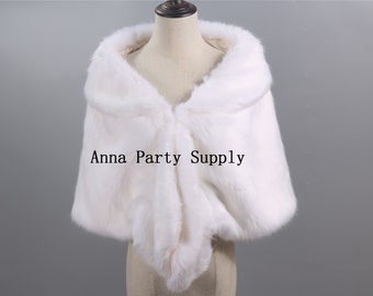May include: White faux fur shawl with a collar. The shawl is draped over a white mannequin. The text "Anna Party Supply" is printed on the shawl.
