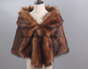 May include: A brown faux fur shawl with a long, flowing design. The shawl is made of soft, plush fabric and has a luxurious feel.