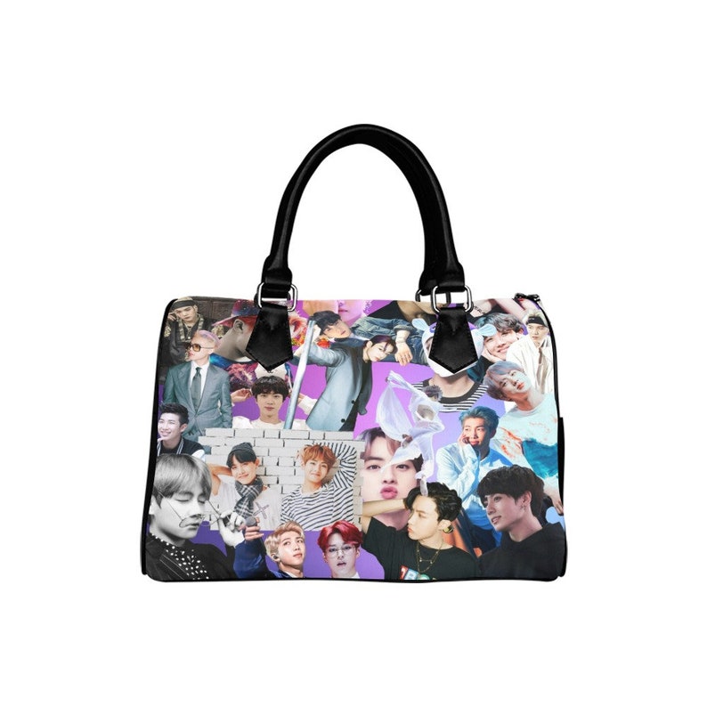 May include: A black leather handbag with a purple and white collage of photos of a boy band. The photos are of different members of the band, and they are all smiling and looking at the camera.