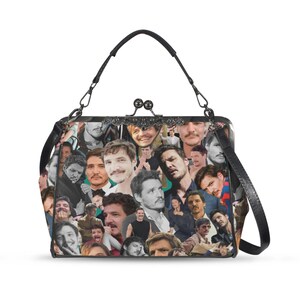 May include: A black and white handbag featuring a collage of images. The bag has a black handle and a detachable shoulder strap. The clasp is a decorative metal design.