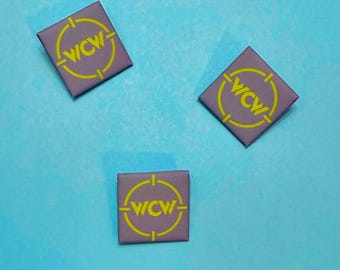 WCW 90s mat logo 1.25” button