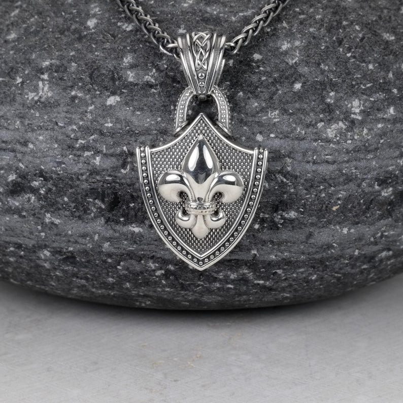 Fleur De Lis Knot Necklace with Spiga Neck Chain, Shield Shape Pendant with Classic Hook Attached to the Frame, the Final Look of the Pendant is Polished Frame and the fleur de lis is Silver Polished (photo 2)