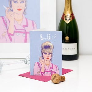 Peut inclure: Une carte de v&oelig;ux illustrant une femme de dessin anim&eacute; avec des cheveux blonds et une veste rose. Le texte sur la carte est "Bollo?"