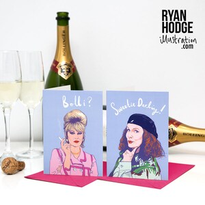 Peut inclure: Deux cartes de v&oelig;ux illustrant des femmes avec le texte "Bolli?" et "Sweetie Darling!" Les cartes sont sur un fond bleu clair et ont des enveloppes roses.