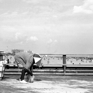 Goings on on the boardwalk, Coney Island, New York City.
